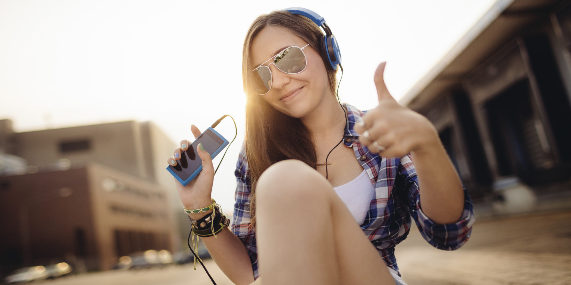 Teenager giving thumbs up